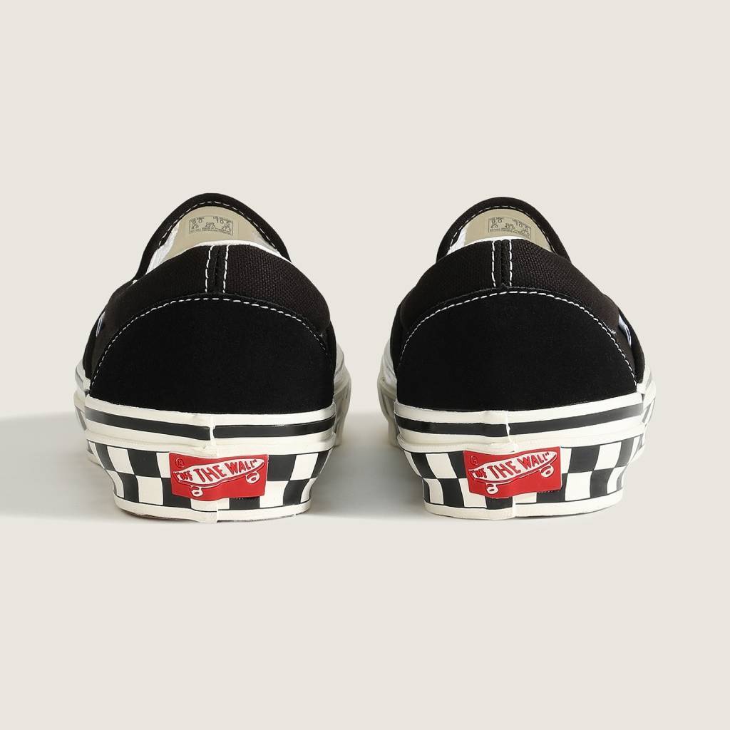 LX Classic Slip-On 98 (CHCKRBRD SIDEWALL BLACK/MARSHMALLOW) #Black/White [VN000E96BPQ]